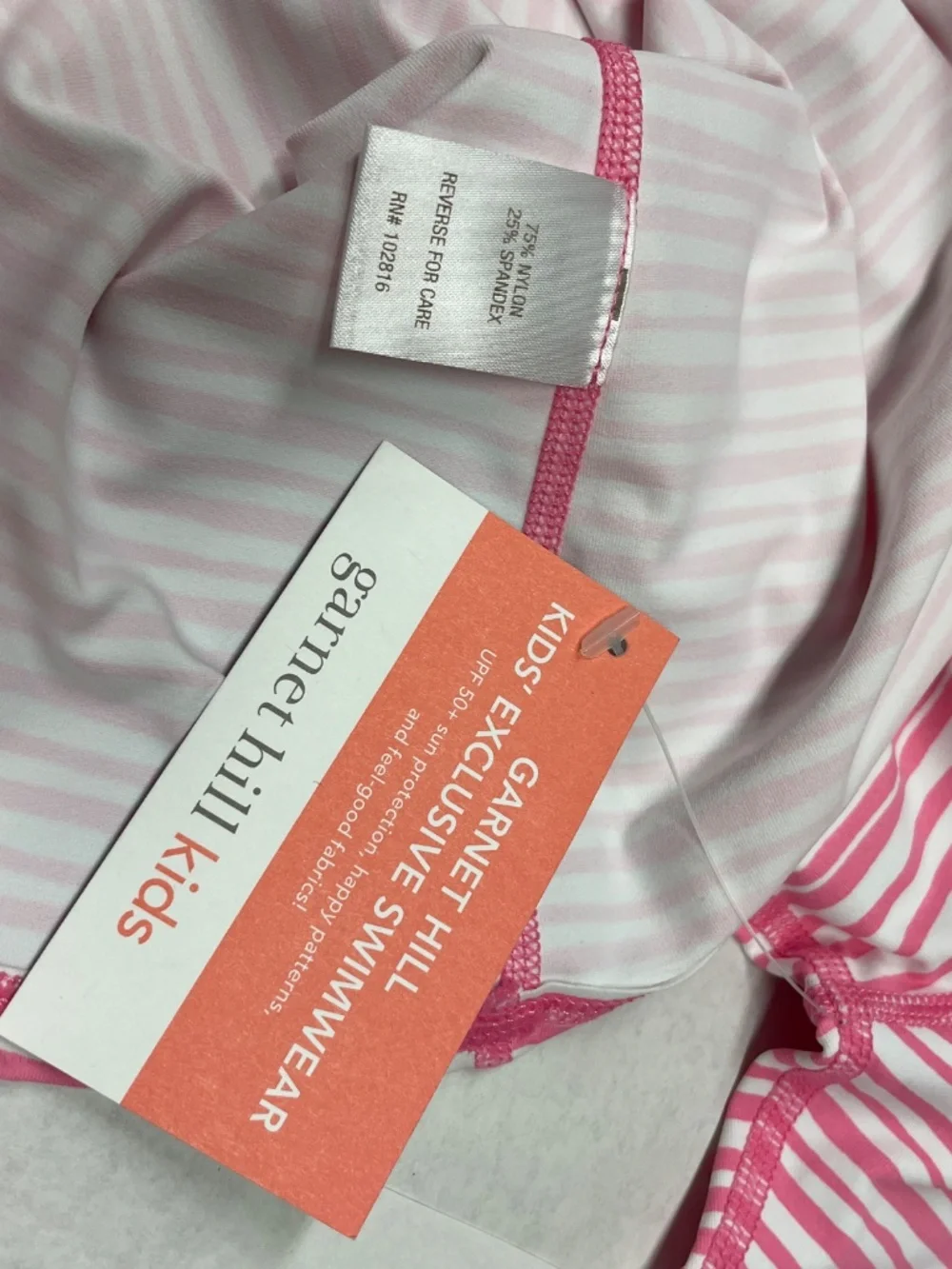 Garnet Hill Kids's Exclusive Swimwear. A pink and white stripe.
